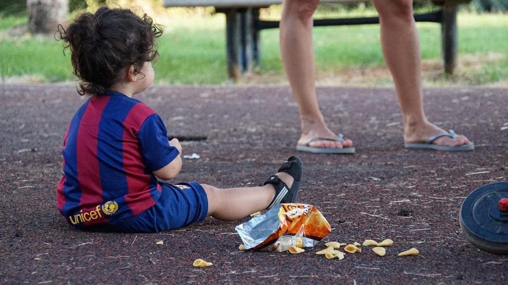 Jobs that let you travel internationally - a small child sitting in a park